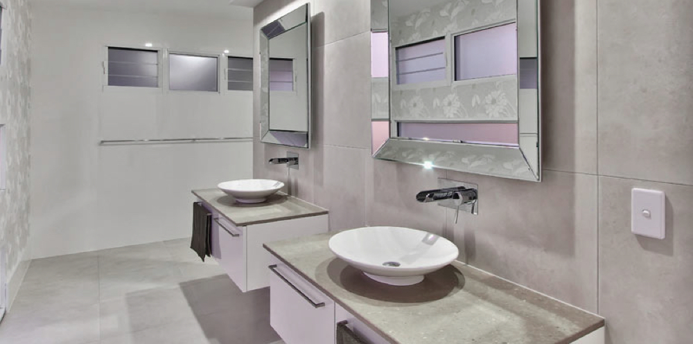 Completed bathroom renovation with wall-hung vanity and chrome tapware