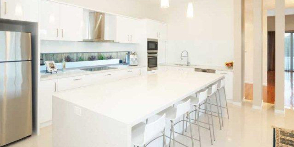 Kitchen fit-off showing dishwasher and sink connections