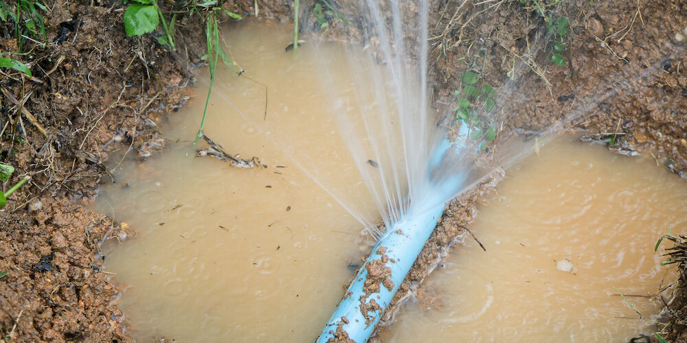 Burst water pipe being isolated and repaired by Accuplumb