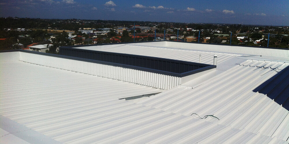 Corrugated metal roof and box gutter repair by Accuplumb
